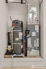 High efficiency Carrier electric forced-air furnace and Electric hybrid water heater.