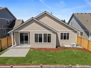 Backyard is landscaped and fully fenced with a patio.