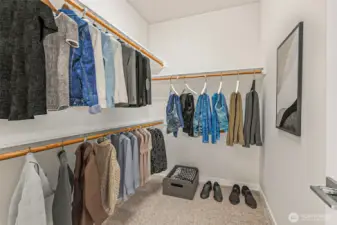 Virtually staged primary closet.