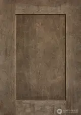 Shaker-style Cocoa-stained maple cabinets throughout.