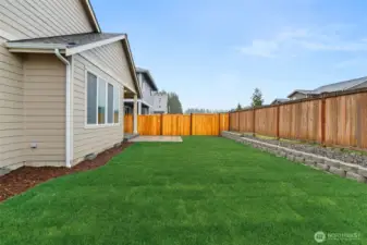 Backyard is fully landscaped.
