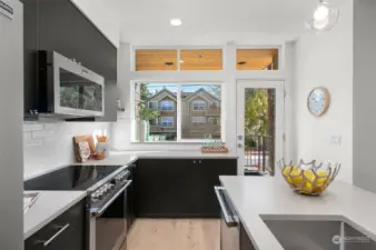 A true chef’s dream, this kitchen combines form and function with ample counter space and a scenic view from the window.