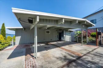 Front of home with 2 car covered Carport and 1 additional Parking Space.