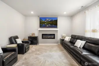 The Living Room has lots of space for the larger families and gatherings. A cozy fireplace too!