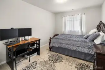 The main level 5th bedroom. Has closet to the left side. This does make a good Home Office / Den.  Also ideal for a guest room.