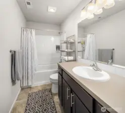 Hall bathroom upstairs has shower over the tub