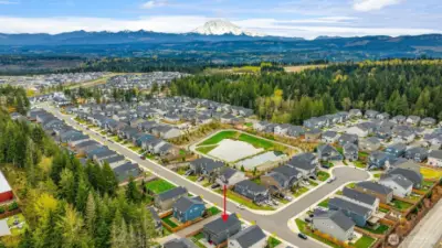 The homes is where the red arrow points to.  Nice views of Mt Rainier in the distance.  Community Play Areas for children.