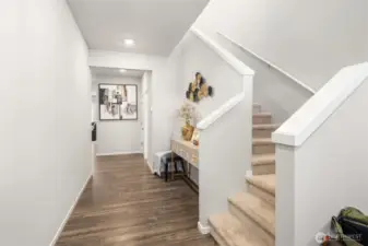 As you come into the house there is nice wood floors, and space to use as you desire.  Notice the good natural light coming into the house from the front windows and upper hallway.