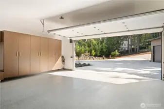 Pull right into the driveway in the 2-car attached with so many cabinets & a work bench