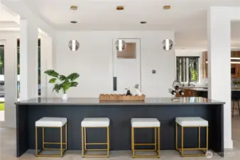 Floating buffet with refrigerator and freezer drawers on the other side. The door behind the floating buffet leads to the Pantry room with and extra refrigerator/freezer and so many cabinets!
