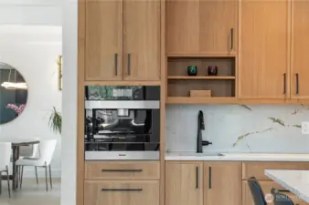 Make your morning Joe in the built-in Miele. Fix a drink at the bar-style quartz laden countertops, complete with 2nd sink at The Pointe at Lake Sawyer