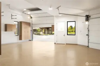 Another view of the inside detached shop, featuring the 12 foot high garage door to accommodate your Boat/RV.