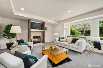 Close up of living with recessed lighting and large window.