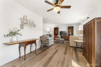 Kitchen opens to informal dining space and living room