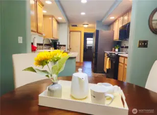 View from breakfast nook to walk through kitchen