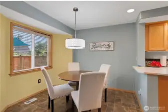 Breakfast nook with access to back deck and yard.