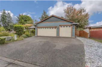 Large Parking pad and 750 sq ft garage. Plenty of room to park the RV and Boat.  NO HOA TO PREVENT YOU!