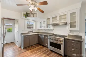 Kitchen with gas range, modern updates, and ample storage.