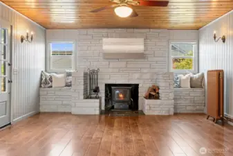 Family room with classic fireplace and abundant natural light.