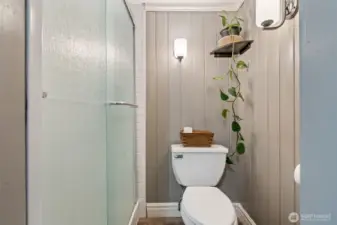 Updated bathroom with modernized shower.