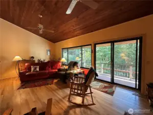 Living room on the main with beautiful hardwood floors, deck access.