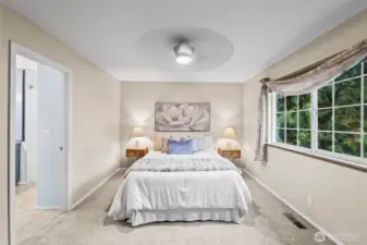 Your primary suite features a walk-in closet and beautifully updated en suite bath