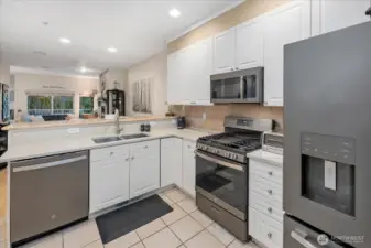Plenty of cabinets, tiled backsplash, and premium stainless steel appliances.