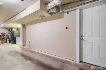 Tandem garage with plenty of storage, laundry, and interior entry.