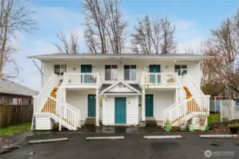 Rear entries to the units. Middle door, ground level is the laundry room.