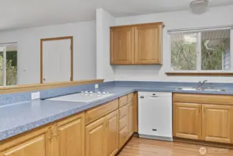 Leading into the kitchen is a half wall for easy entertaining as you cook.