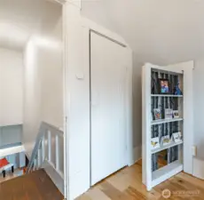 Second bookshelf opens to additional storage emphasizing amazing use of space.