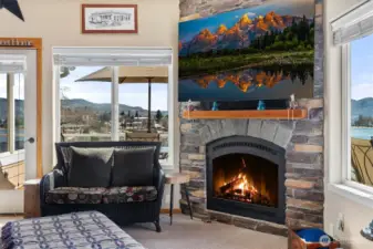 Propane fireplace upper living room, side door to deck