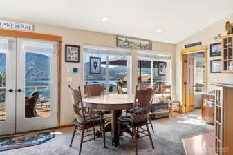 Dining area and entrance to primary 1 Bedroom suite, kitchen to right