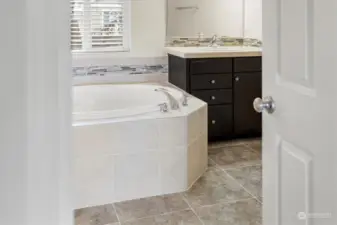 Primary bath with soaking tub and walk in shower.