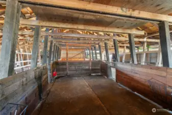 The barns are equipped with large stalls, perfect for accommodating larger animals, and versatile enough to serve as holding pens for groups of smaller animals. This flexible setup ensures the property can meet a variety of livestock or storage needs.