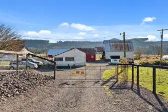 This property is thoughtfully designed for functionality and convenience, featuring three spacious barns and a former milk house, all interconnected by well-planned holding pens and alleyways. Ideal for livestock management, the layout ensures ease of movement and efficient operations. Additionally, the outdoor arena area provides ample space for training, riding, or other agricultural activities, making this property a versatile choice for those seeking a move in ready farm