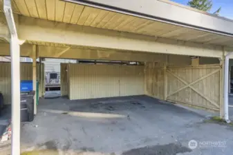 2 covered parking spots and double sided built in  storage shed