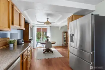 Wonderfully wide open, a kitchen/dining area with plenty of room for gatherings.
