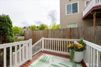 Room for an outdoor table and BBQ.  You could also grow a vertical garden.