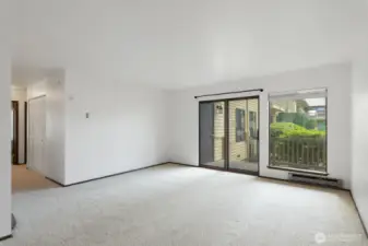 Living room with slider out to patio and courtyard