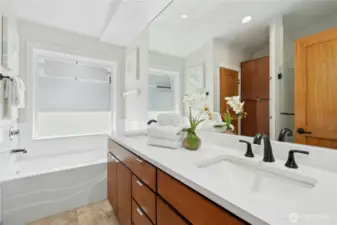 Radiant floor heating, timer-controlled exhaust fans, and a retractable wall-mounted drying rack
