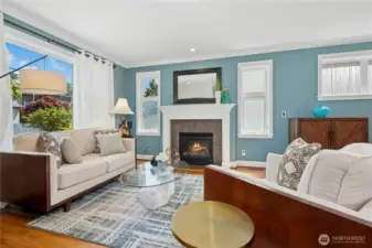Gas fireplace with custom wood mantel anchors the cozy living space