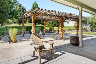 The centerpiece of the patio is a custom arbor made from select burl timbers