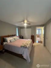 Primary bedroom w/slider to exterior private deck & ensuite bath.