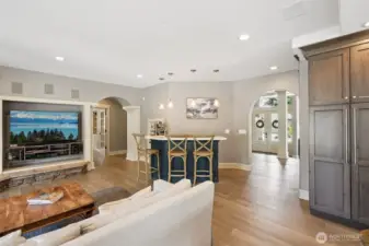 Statement fireplace and oversized windows invite comfort and connection”