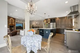 Fully remodeled kitchen with Wolf range, quartz countertops, and RH lighting