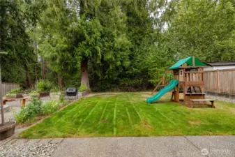Fenced backyard backs a greenbelt, offering added privacy