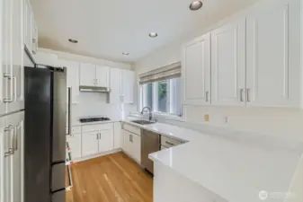 Fully remodeled kitchen with new cabinets and quartz countertops