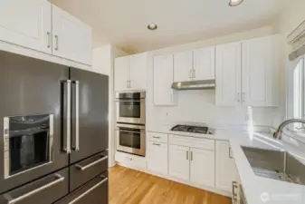 Fully remodeled kitchen with new cabinets and quartz countertops and stainless steel appliances
