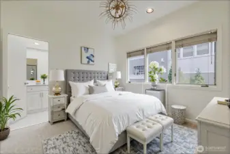Full bedroom with access to a full bathroom.